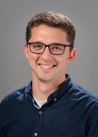 Picture of white male with glasses, brown hair